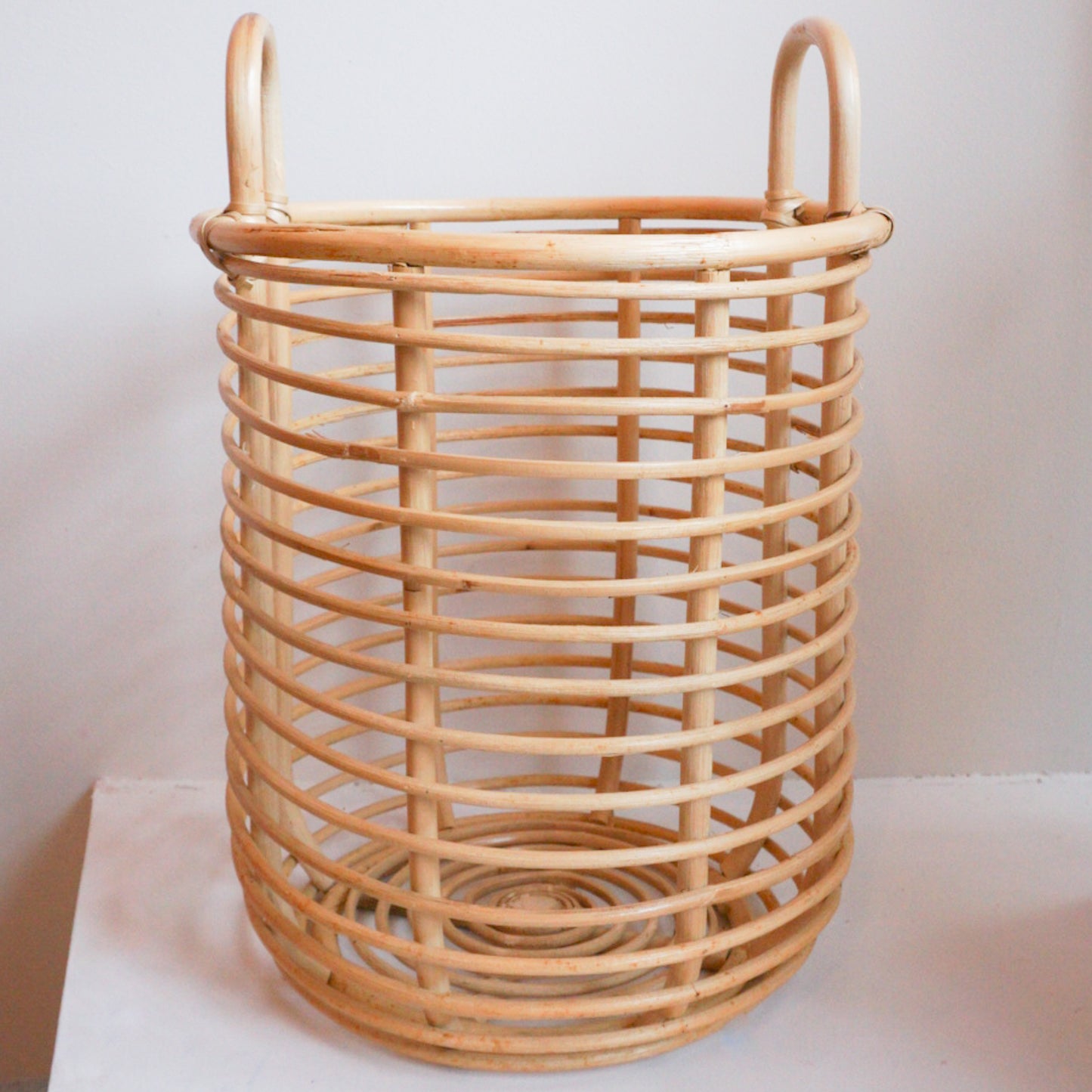 Large round rattan basket with handles for storage