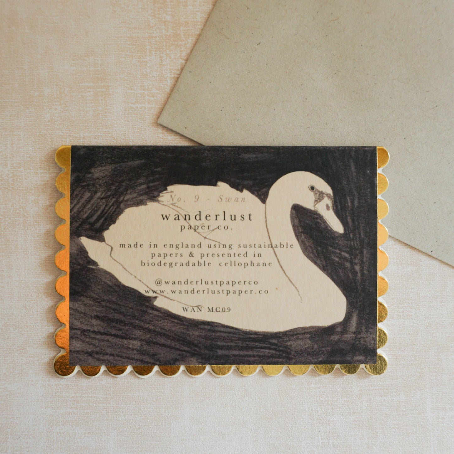 Eco-friendly mini greeting card with intricate gold scalloped edge detail and a beautiful swan image