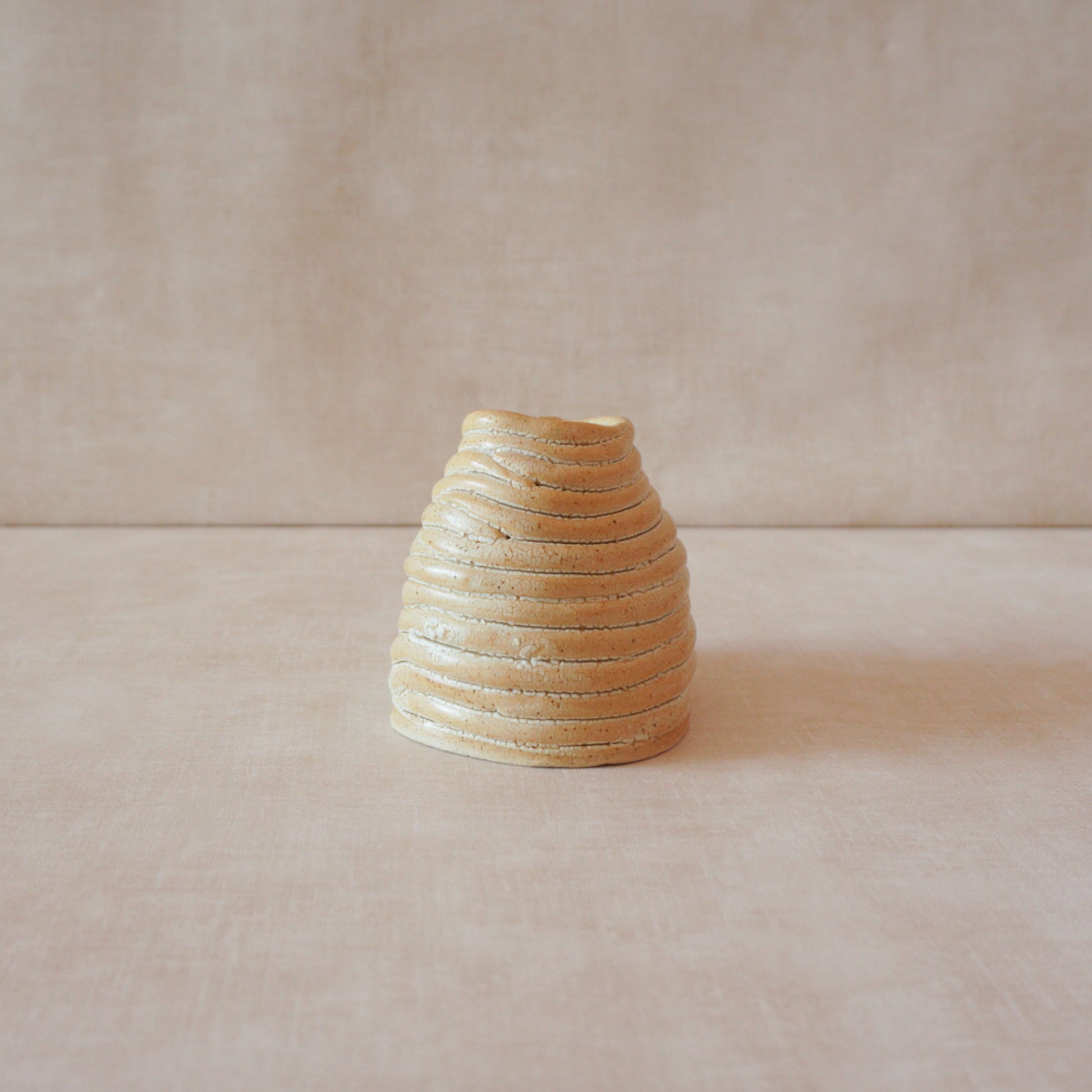 Handcrafted ceramic vase with organic form and natural texture