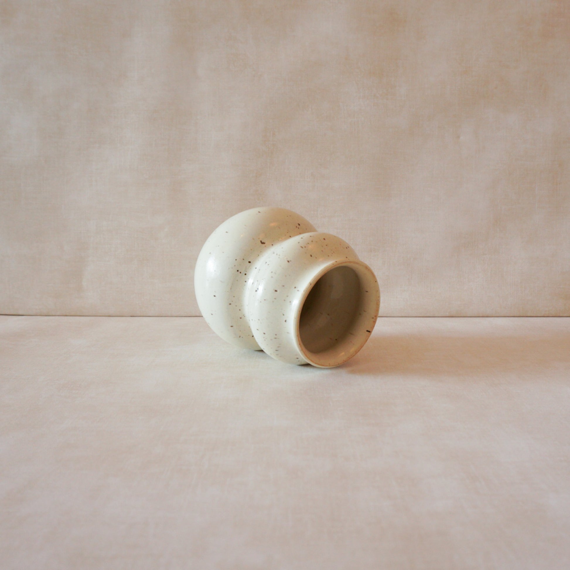 Minimalist cream speckled vase with simple yet refined design