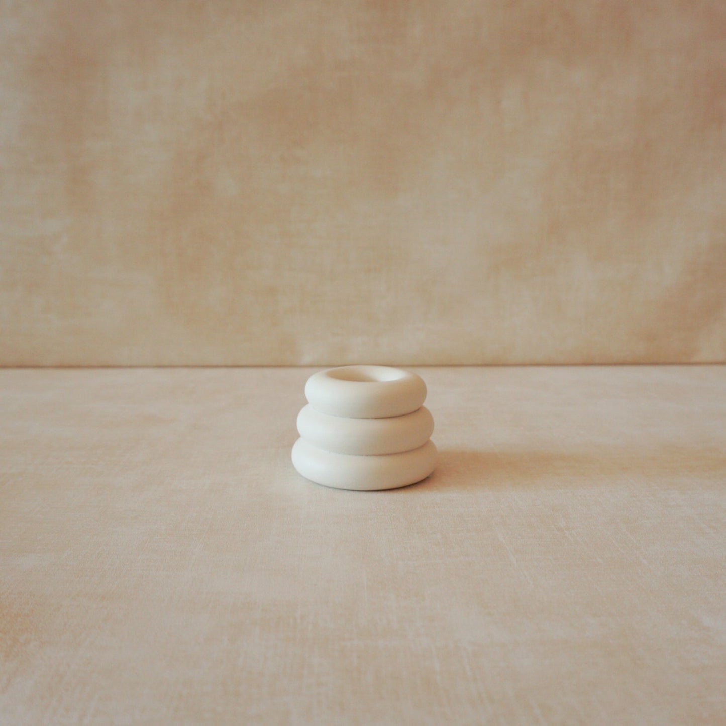 Rings candle holder for tapered candles with simple and versatile design