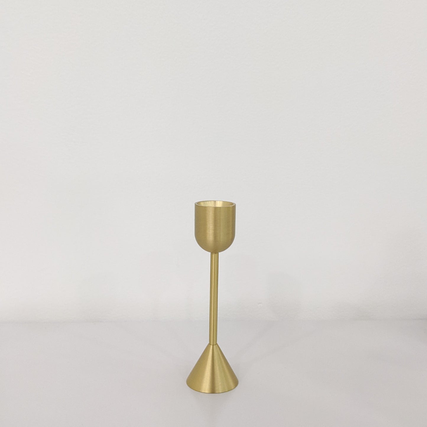 Simple and stylish brass candlestick holder to elevate any space