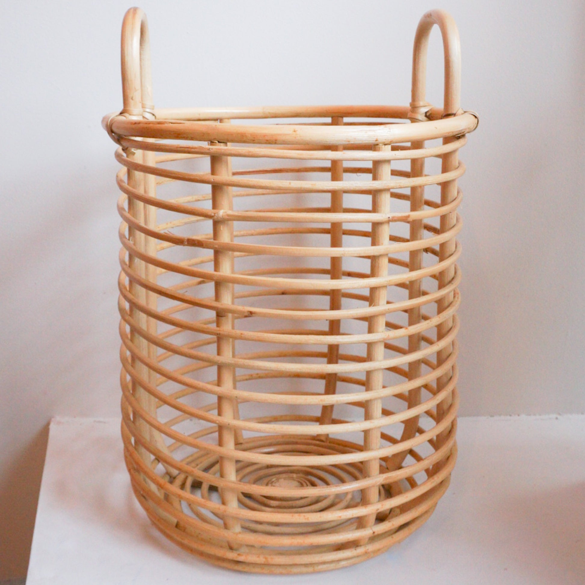Large round rattan basket with handles for storage
