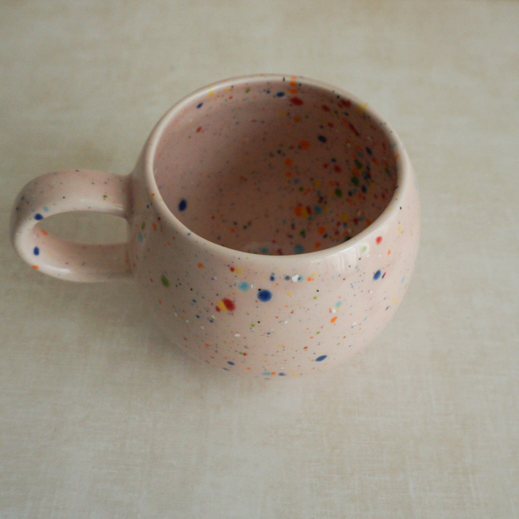 Fun and festive confetti mug in pink